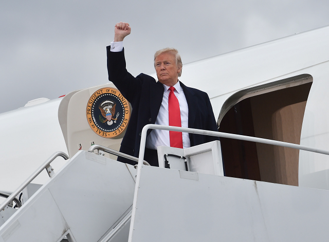 us president donald trump gestures before boarding airforce one after a campaign rally at the huntington tri state airport on november 2 2018 in huntington west virginia photo afp
