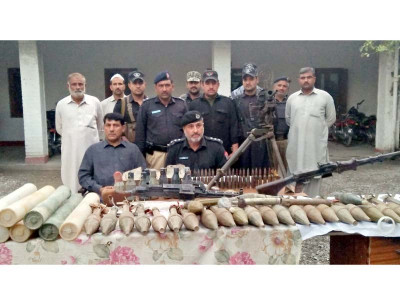 exhumed police recover arms ammo from grave exhumed police recover arms ammo from grave