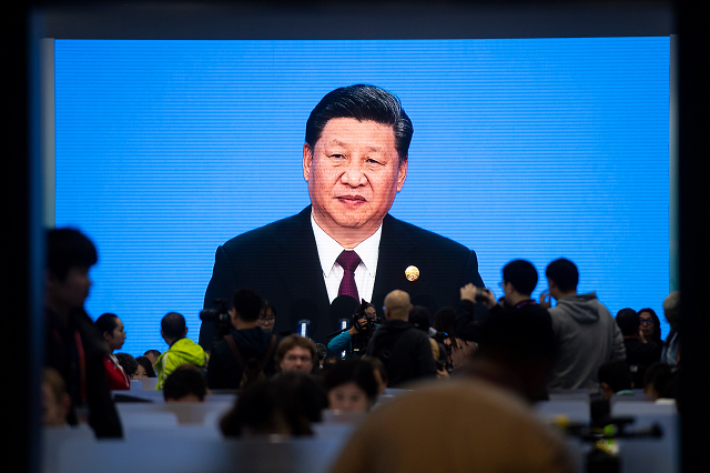 china 039 s president xi jinping is seen on a big screen in the media centre as he speaks at the opening ceremony of the first china international import expo ciie in shanghai on november 5 2018 photo afp china 039 s president xi jinping is seen on a big screen in the media centre as he speaks at the opening ceremony of the first china international import expo ciie in shanghai on november 5 2018 photo afp