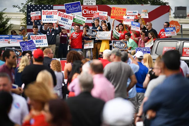 supporters await the arrival of republican candidate for governor of florida ron desantis as they attend a rally at freedom pharmacy on the final day of campaigning in the midterm elections photo afp supporters await the arrival of republican candidate for governor of florida ron desantis as they attend a rally at freedom pharmacy on the final day of campaigning in the midterm elections photo afp
