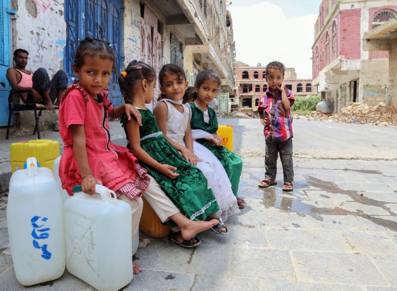 displaced yemeni children from hodeida province sit on water containers in a street in the southwestern yemeni city of taez photo afp