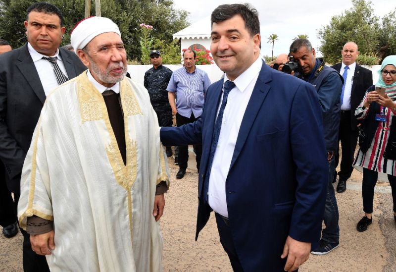 tunisia 039 s new tourism minister rene trabelsi r meets the country 039 s grand mufti othman battikh at the ghriba synagogue on djerba island photo afp