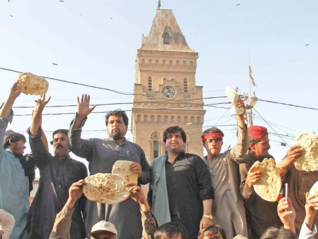 shopkeepers holding rotis bread in their hands protest against the anti encroachment drive and claim that it deprives them of their only source of income photo athar khan express shopkeepers holding rotis bread in their hands protest against the anti encroachment drive and claim that it deprives them of their only source of income photo athar khan express