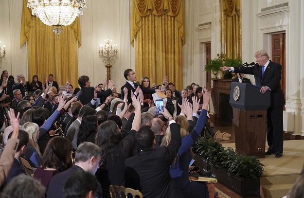 us president donald trump points to journalist jim acosta c from cnn during a post election press conference in the east room of the white house in washington dc on november 7 2018 photo afp