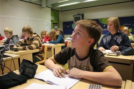 students listen to their teacher during a maths lesson at the hakunila middle school in vantaa photo reuters