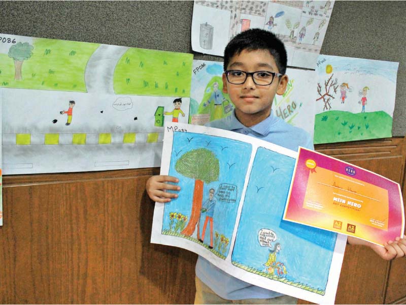 students engaged in drawing themselves as heroes solving local problems the objective of the competition was to facilitate underprivileged students to use art as a medium of expression photos athar khan express