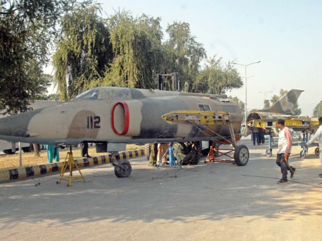 a fighter jet a5 c being put on display at 9th avenue in islamabad photo zafar aslam express a fighter jet a5 c being put on display at 9th avenue in islamabad photo zafar aslam express