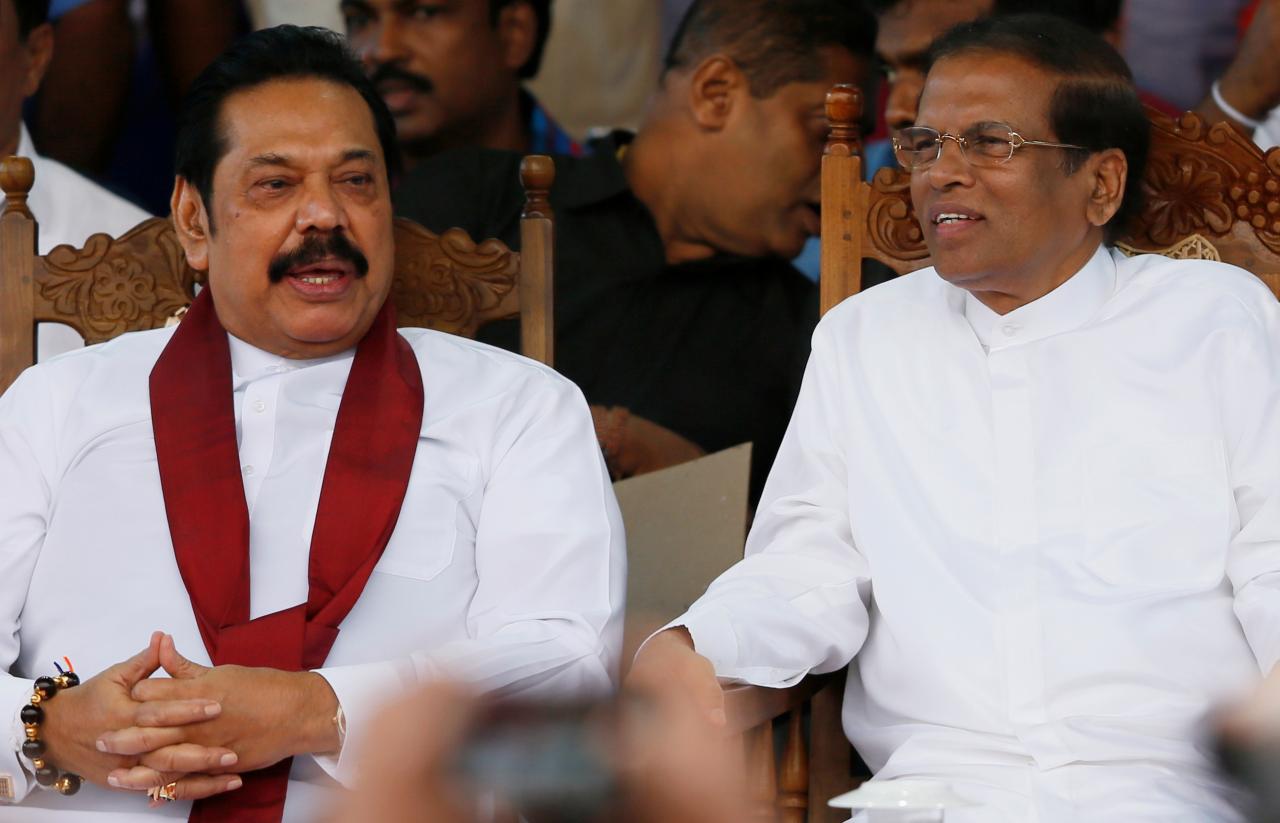 sri lanka 039 s newly appointed prime minister mahinda rajapaksa and president maithripala sirisena talk during a rally near the parliament in colombo sri lanka photo reuters