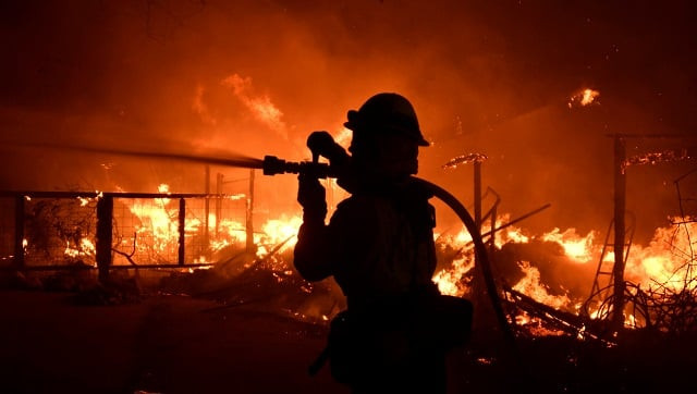 a firefighter hoses down a condo unit during the woosley fire in malibu california u s november 9 2018 photo reuters a firefighter hoses down a condo unit during the woosley fire in malibu california u s november 9 2018 photo reuters