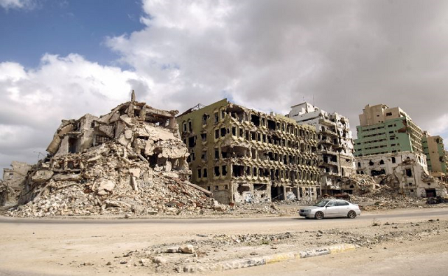 a picture taken february 15 2018 shows a view of destroyed buildings along the seaside promenade of libya 039 s eastern city of benghazi near the courthouse where demonstrations first broke in february 2011 protesting against the rule of muammar gaddafi photo afp