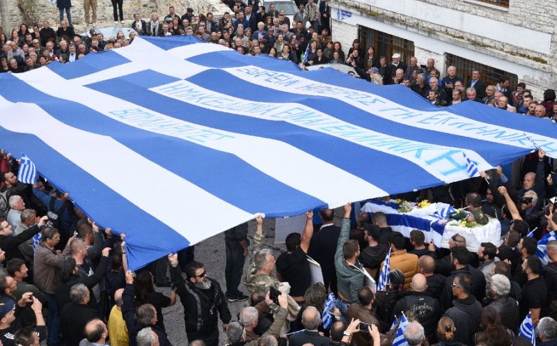 hundreds of people many from greece attended the funeral of konstantinos katsifas an ethnic greek killed during a shootout with albanian police photo afp