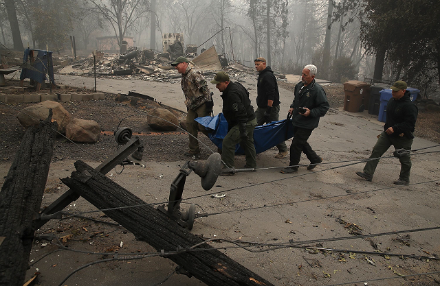 yuba and butte county sherriff deputies carry a body bag with a deceased victim of the camp fire photo afp yuba and butte county sherriff deputies carry a body bag with a deceased victim of the camp fire photo afp