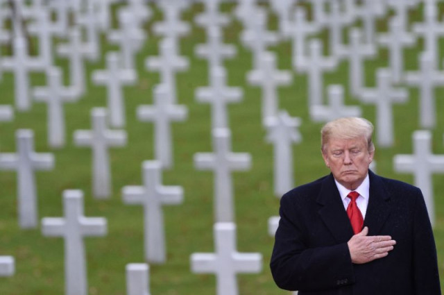 us president donald trump takes part in a ceremony at the american cemetery of suresnes outside paris on november 11 2018 as part of veterans day and commemorations marking the 100th anniversary of the 1918 armistice ending world war i photo afp us president donald trump takes part in a ceremony at the american cemetery of suresnes outside paris on november 11 2018 as part of veterans day and commemorations marking the 100th anniversary of the 1918 armistice ending world war i photo afp