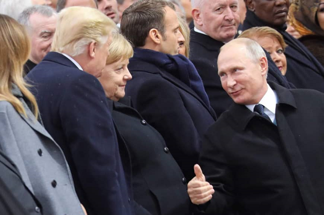 russian president vladimir putin right talks with german chancellor angela merkel center and u s president donald trump as they attend a ceremony at the arc de triomphe in paris on sunday as part of commemorations marking the 100th anniversary of the end of world war i photo afp russian president vladimir putin right talks with german chancellor angela merkel center and u s president donald trump as they attend a ceremony at the arc de triomphe in paris on sunday as part of commemorations marking the 100th anniversary of the end of world war i photo afp