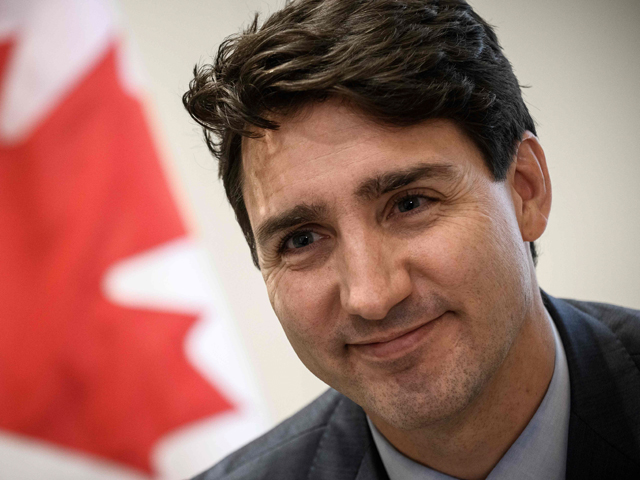 canadian prime minister justin trudeau looks on during an interview at the canadian embassy in paris on november 12 2018 photo afp