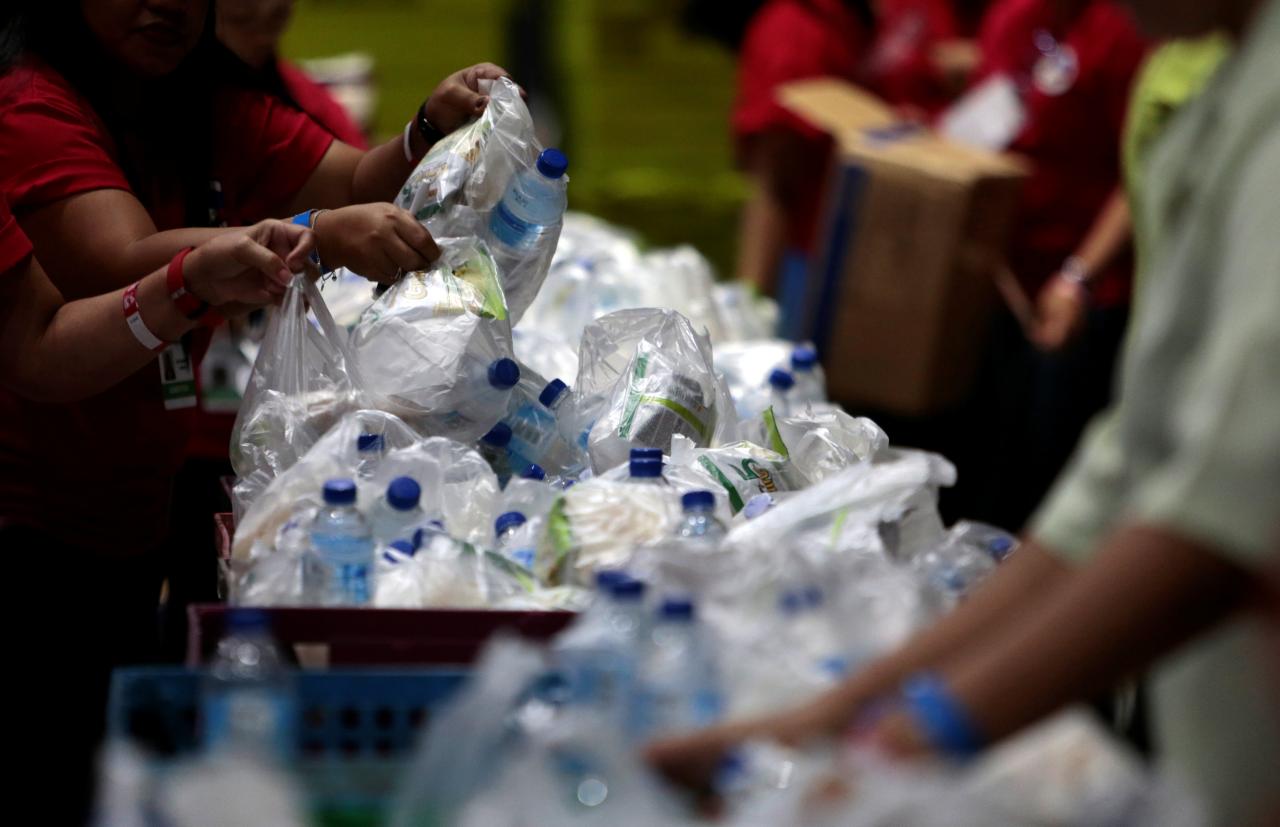 plastic bags and bottles are given out during an event in singapore photo reuters