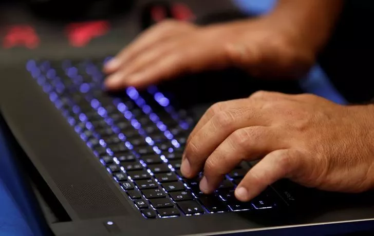 a man types into a keyboard photo reuters a man types into a keyboard photo reuters