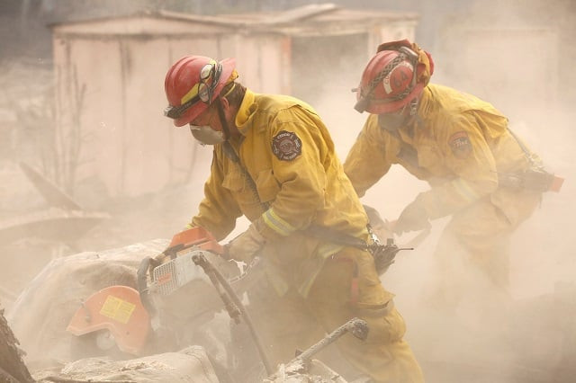 cal fire firefighters comb through a house destroyed by the camp fire in paradise california u s november 13 2018 photo reuters