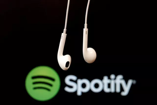 headphones are seen in front of a logo of online music streaming service spotify in this february 18 2014 illustration picture photo reuters headphones are seen in front of a logo of online music streaming service spotify in this february 18 2014 illustration picture photo reuters