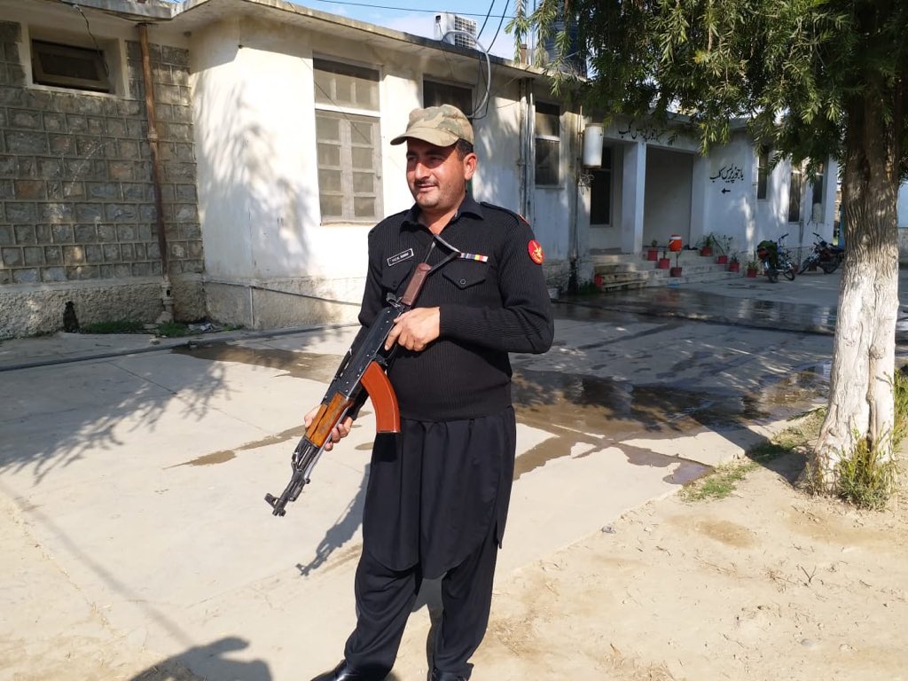 policeman guards the bajaur press club photo hasbanullahkhan twitter