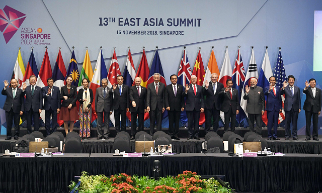 world leaders pose for a group photo before the start of the 13th east asia summit plenary session on the sidelines of the 33rd association of southeast asian nations asean summit in singapore on november 15 2018