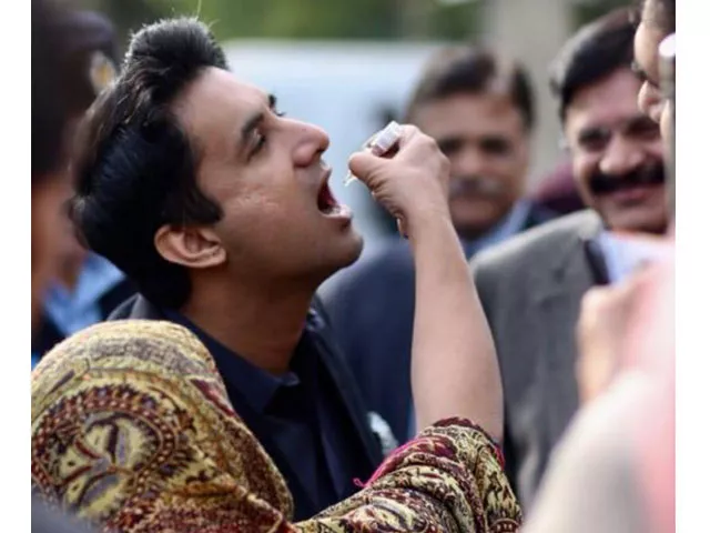 islamabad deputy commissioner consumes polio drops to convince reluctant parent photo express islamabad deputy commissioner consumes polio drops to convince reluctant parent photo express