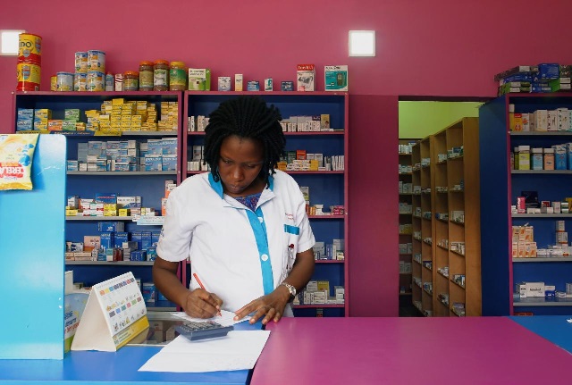 a vendor writes as she stands in a legal pharmacy in abidjan ivory coast photo reuters