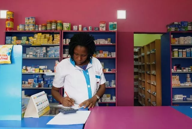 a vendor writes as she stands in a legal pharmacy in abidjan ivory coast photo reuters a vendor writes as she stands in a legal pharmacy in abidjan ivory coast photo reuters