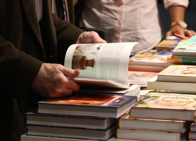 people look at books at a book fair photo afp