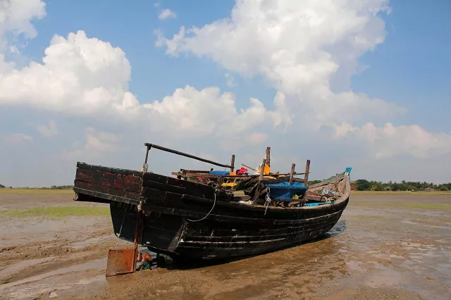 a stranded boat which was used by rohingya muslims is seen at the thande village beach outside yangon myanmar november 16 2018 photo reuters a stranded boat which was used by rohingya muslims is seen at the thande village beach outside yangon myanmar november 16 2018 photo reuters