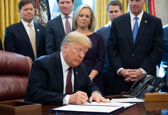 us president donald trump signs the cybersecurity and infrastructure security agency act in the oval office of the white house in washington dc november 16 2018 photo afp us president donald trump signs the cybersecurity and infrastructure security agency act in the oval office of the white house in washington dc november 16 2018 photo afp