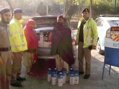 couple caught with 242 bottles of liquor on peshawar islamabad motorway