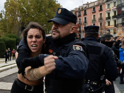 topless femen activists disrupt rally of franco fans in madrid