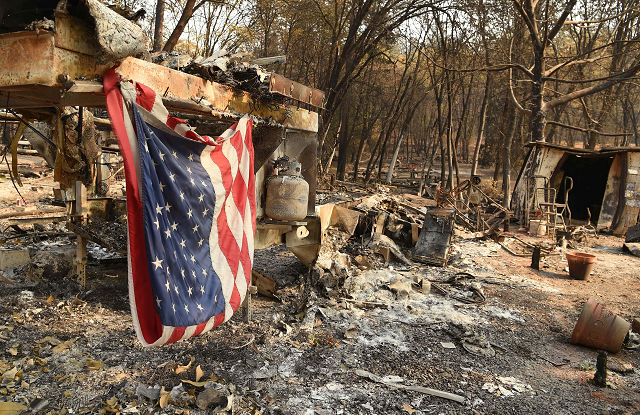 an american flag hangs at a burned out mobile home park in paradise photo afp