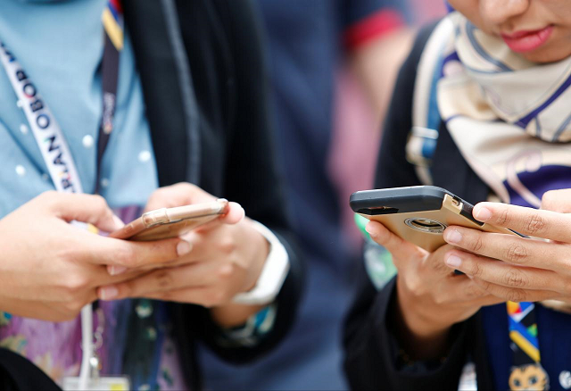 people use their mobile phones at a university in semenyih outside kuala lumpur malaysia november 3 2017 photo reuters