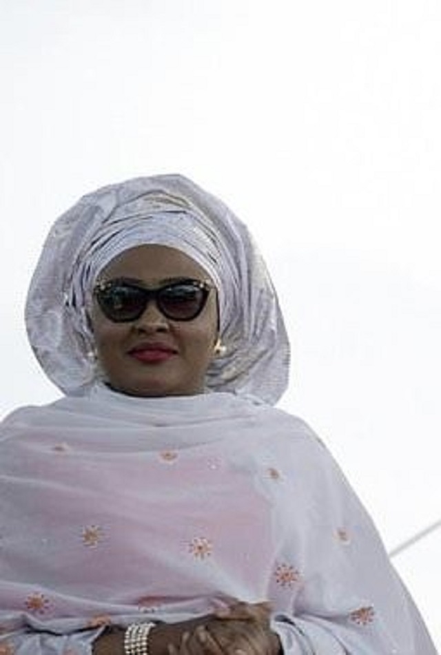 nigerian president mohammadu buhari arrives with his wife aisha before taking oath of office at the eagles square in abuja on may 29 2015 photo afp file