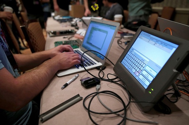 a hacker tries to access and alter data from an electronic poll book in a voting machine hacking village during the def con hacker convention in las vegas nevada us on july 29 2017 photo reuters