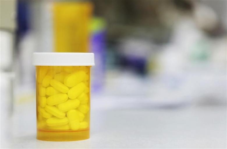 a bottle of prescription medication rests on a counter photo reuters