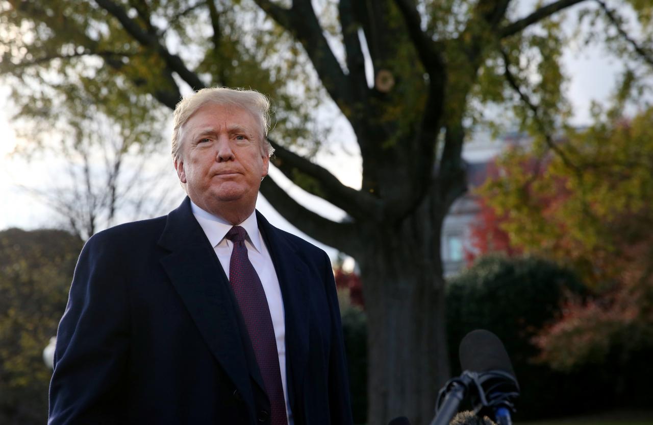 us president donald trump speaks to the news media while walking to board marine one to depart for travel to mar a lago from the white house in washington us photo reuters