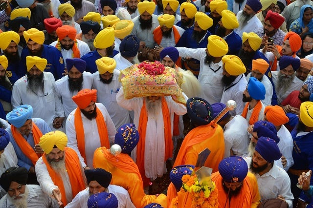 indian sikh priest giani jagtar sigh carries the guru granth sahib central religious text of sikhism during a religous procession from gurudwara ramar to akal takht sahib at golden temple in amritsar on sept 10 2018 photo afp indian sikh priest giani jagtar sigh carries the guru granth sahib central religious text of sikhism during a religous procession from gurudwara ramar to akal takht sahib at golden temple in amritsar on sept 10 2018 photo afp