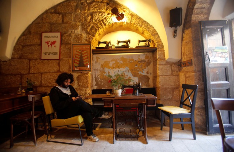 palestinian musician firas harb uses spotify app on his mobile phone in beit sahour in the occupied west bank photo reuters