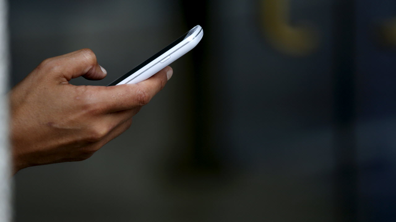 representational image of a man using mobile phone photo reuters