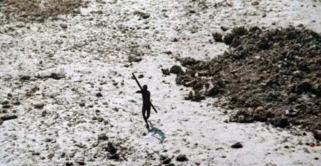 a man with the sentinelese tribe aims his bow and arrow at an indian coast guard helicopter as it flies over north sentinel island in the andamans in 2004 photo afp a man with the sentinelese tribe aims his bow and arrow at an indian coast guard helicopter as it flies over north sentinel island in the andamans in 2004 photo afp