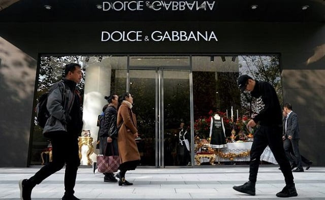 people walk past a dolce amp gabbana store at a shopping complex in shanghai china november 22 2018 photo reuters people walk past a dolce amp gabbana store at a shopping complex in shanghai china november 22 2018 photo reuters