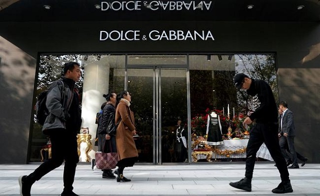 people walk past a dolce amp gabbana store at a shopping complex in shanghai china november 22 2018 photo reuters
