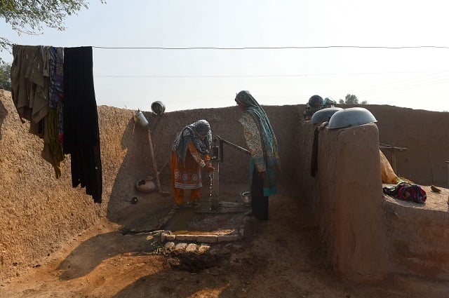 in this picture taken on november 15 2018 pakistani women walk towards a toilet in basti ameerwala village in central punjab province   for as long as she can remember ayeesha siddiqua has fought her male relatives for access to toilets   but a sanitation drive by new premier imran khan could make life easier for women in patriachal pakistan photo afp