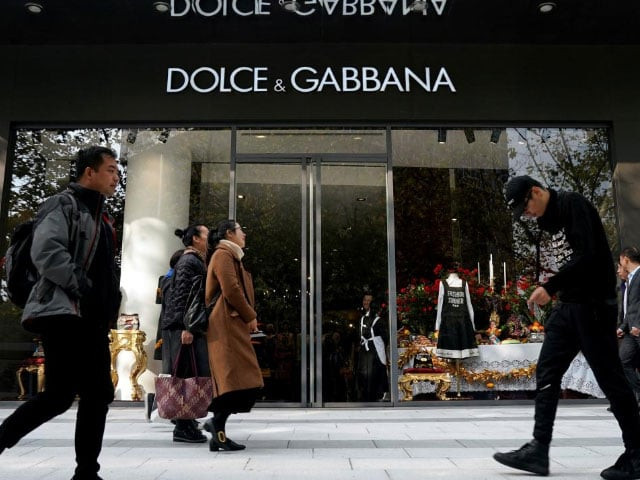 people walk past a dolce amp gabbana store at a shopping complex in shanghai china november 22 2018 reuters aly song people walk past a dolce amp gabbana store at a shopping complex in shanghai china november 22 2018 reuters aly song