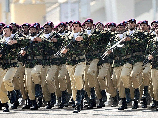 soldiers of special services group march past during a ceremony of pakistan national day photo app