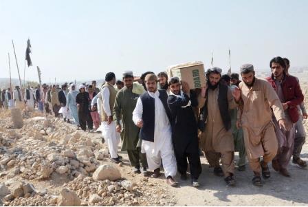 people carry coffins of father and son died in attack on chinese consulate in karachi photo online