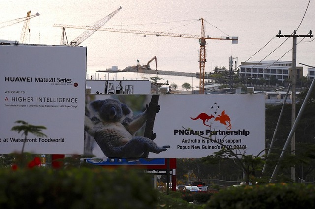 a billboard advertising chinese 039 s huawei can be seen next to another billboard displaying an australian koala and statement declaring australia 039 s support for papua new guinea a day after the asia pacific economic cooperation apec forum ended in port moresby papua new guinea november 19 2018 photo reuters